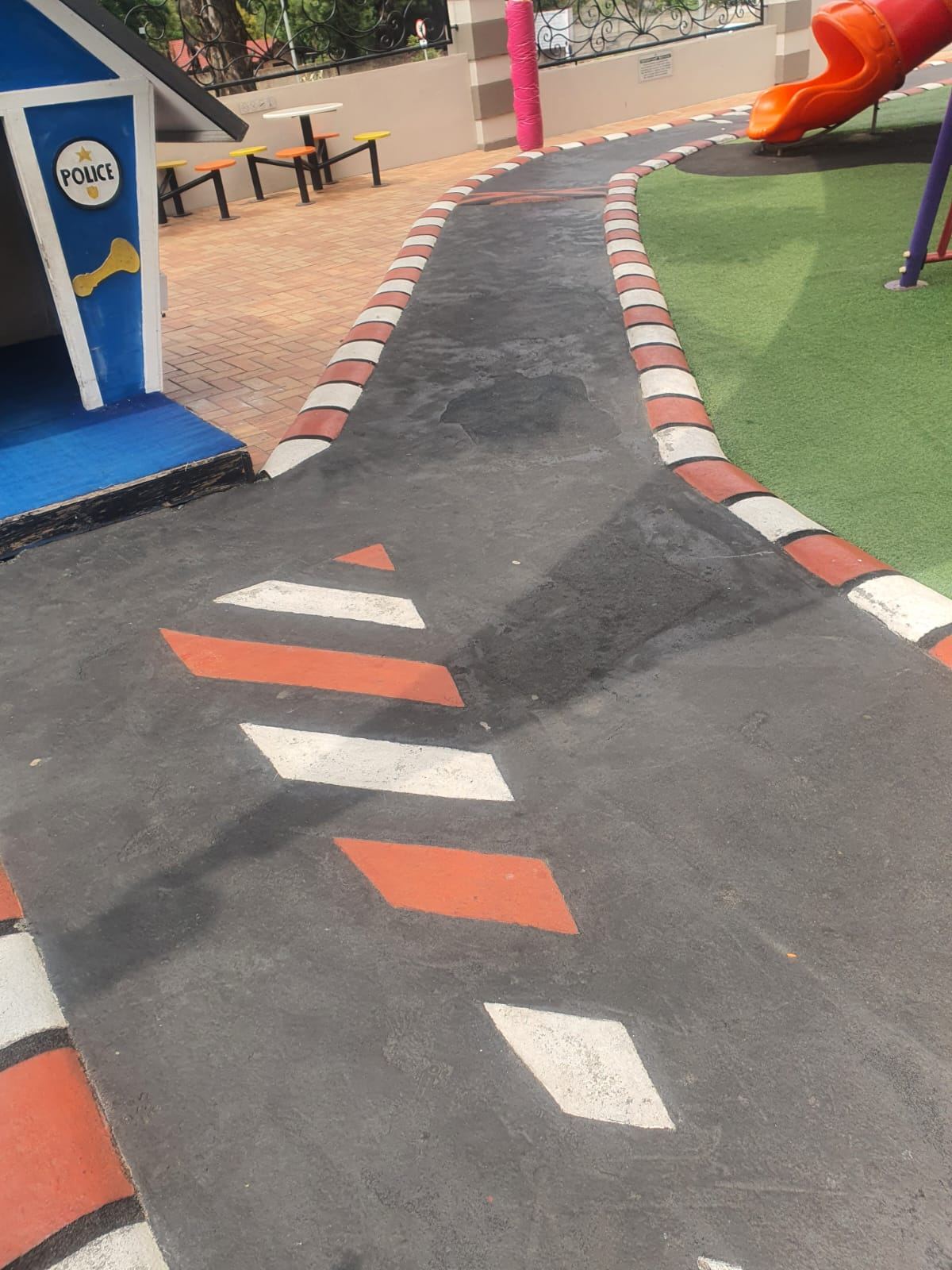 Resurfaced play area with painted markings