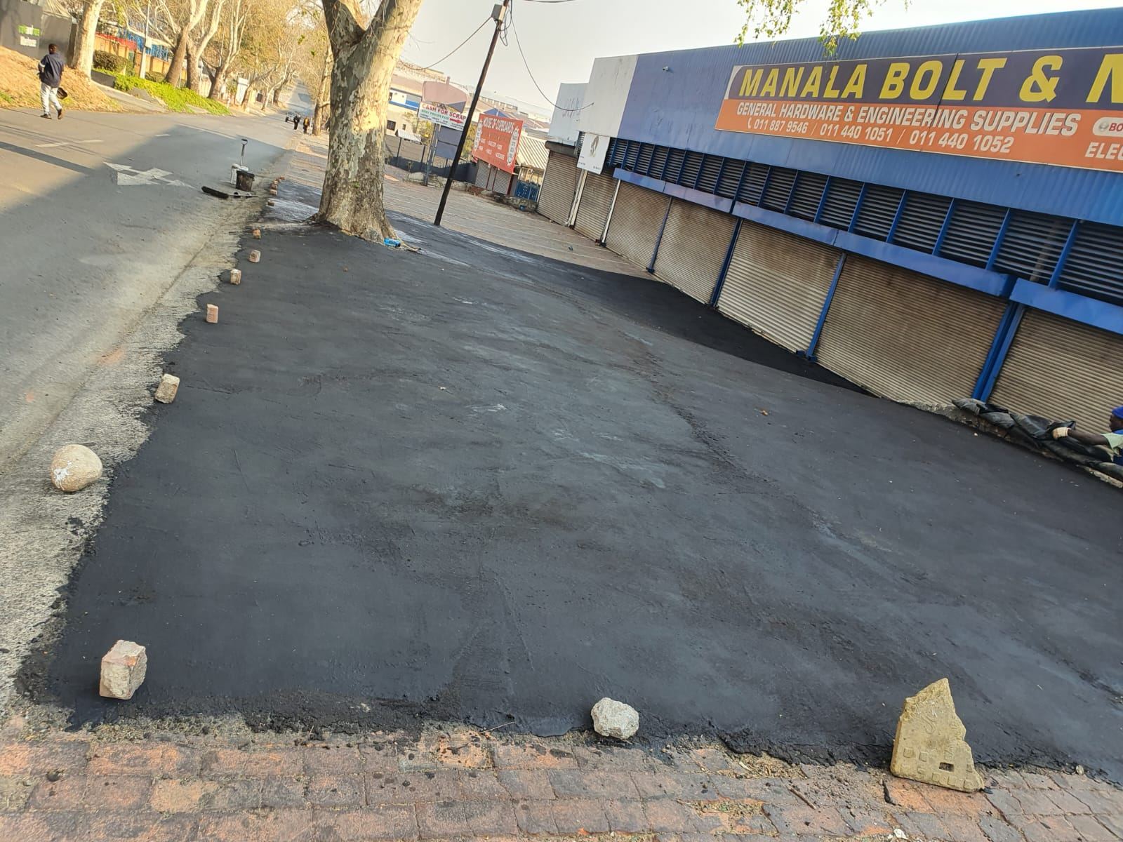 Tar surfacing outside commercial premises